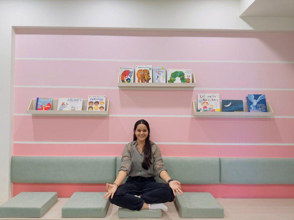 Ritu Mishra seated in the children's reading corner at Swayam